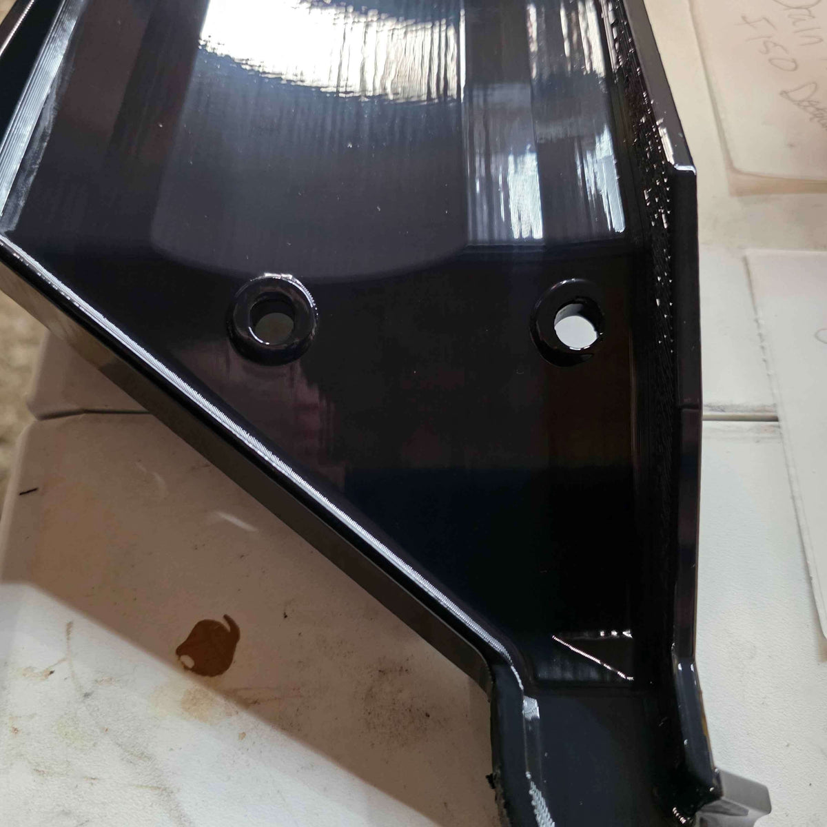Close-up of Factory Drain Tray for F-150 & Expedition 20152025 with mounting holes visible.