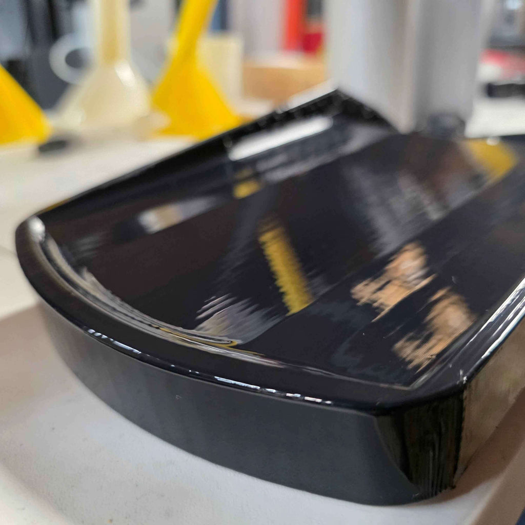 Close-up of the Factory Drain Tray for F-150 & Expedition 20152025 showing sleek black design and smooth finish.